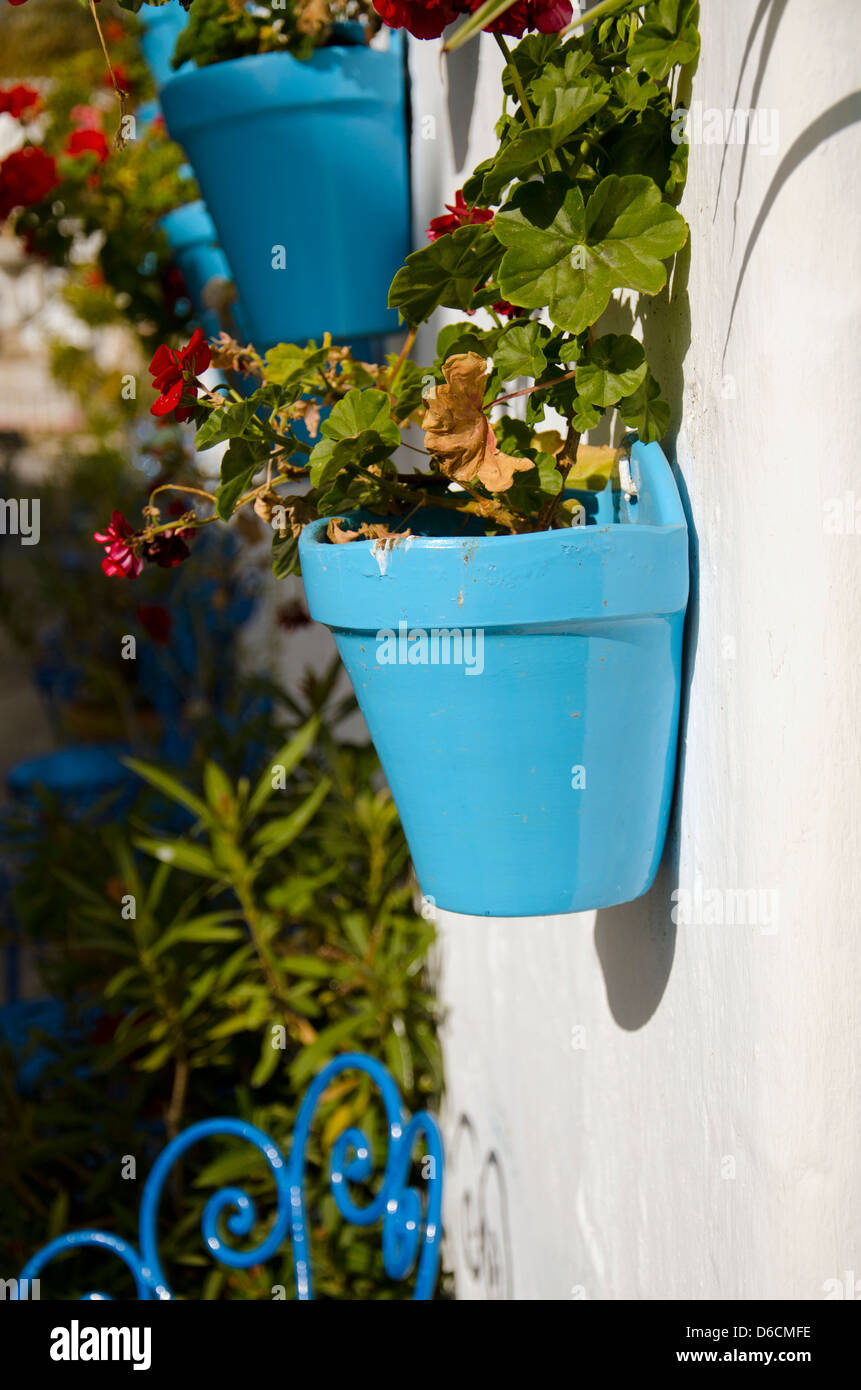 Blue flower pot white washed village of Mijas Pueblo in Spain Stock Photo