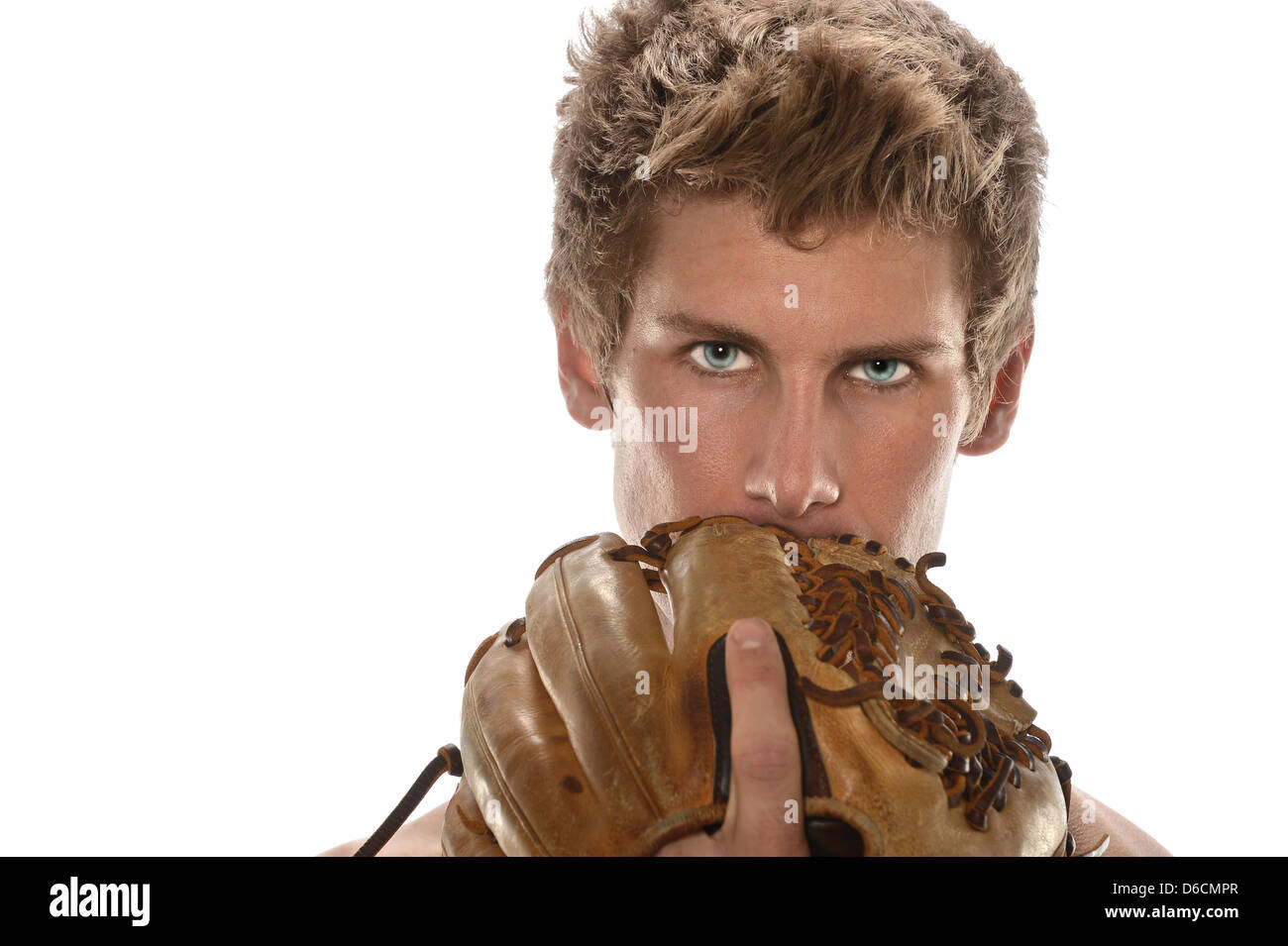 Young man holding baseball glove in front of face isolated over white background Stock Photo Alamy