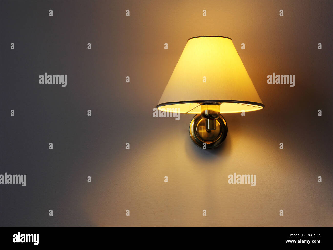 Wall lamp with yellow shade from canvas Stock Photo