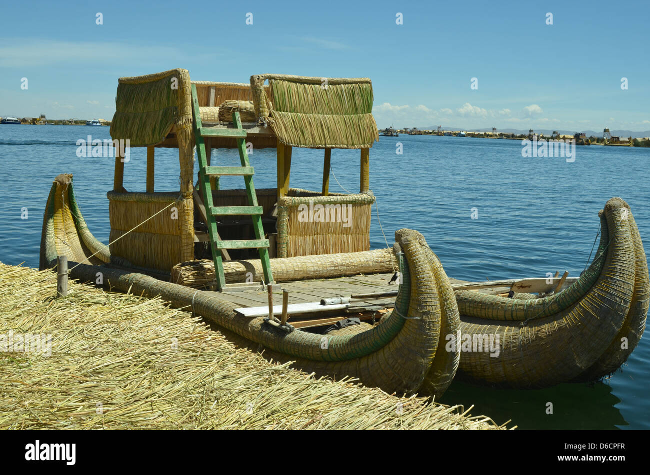 Totoro Reeds Local houses and boats made of totora reeds on the Uros Islands of Lake ...