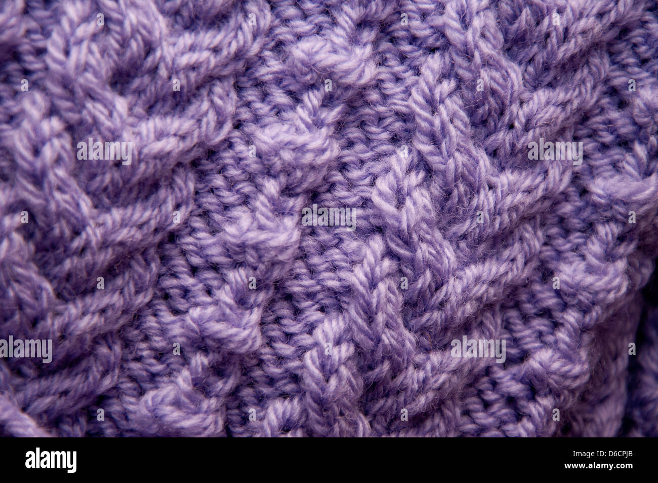 wool knitted garment in close up, texture, detail, abstract, side lit, handicrafts, past times, hobbies Stock Photo