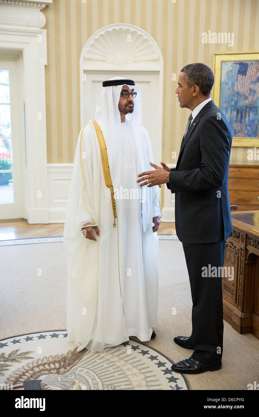 US President Barack Obama greets Crown Prince of Abu Dhabi and Deputy Supreme Commander of the UAE Armed Forces Sheikh Mohammed bin Zayed Al Nahyan in the Oval Office of the White House before their lunch April 16, 2013 in Washington, DC. Stock Photo