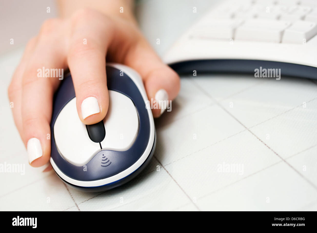 Female hand holding computer mouse Stock Photo - Alamy
