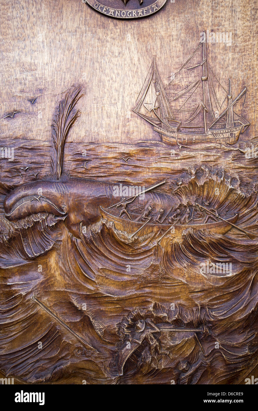 Wooden carving of Basque whale hunters on the door to the Oceanography Society of Guipuzcoa. San Sebastián, Spain Stock Photo