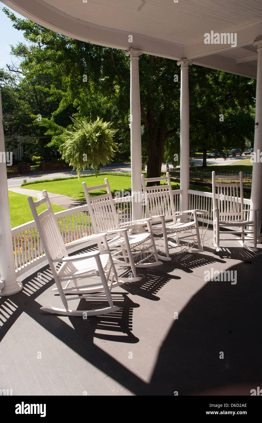 White rocking chairs on a porch Stock Photo