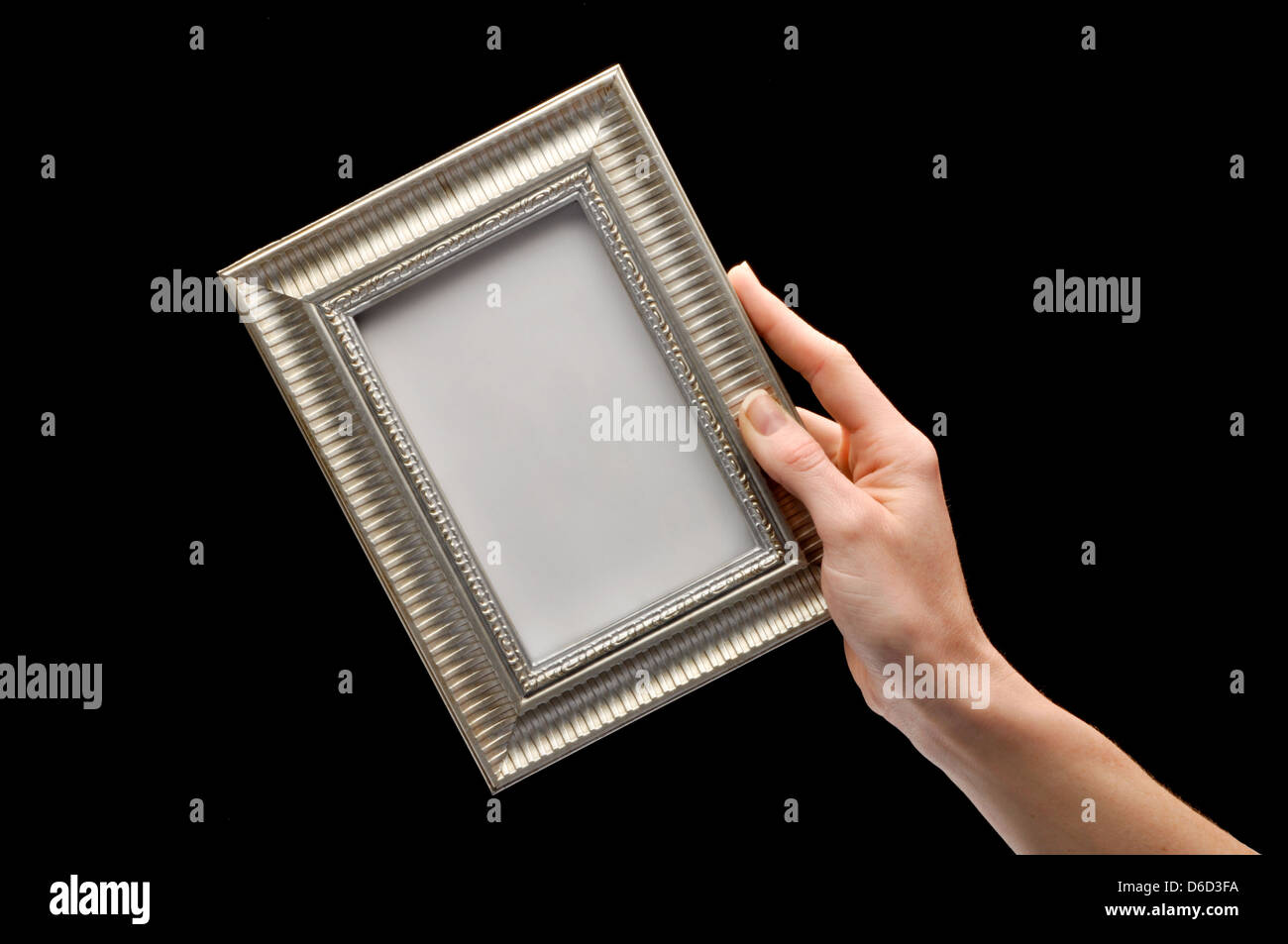 hand holding empthy picture frame Stock Photo