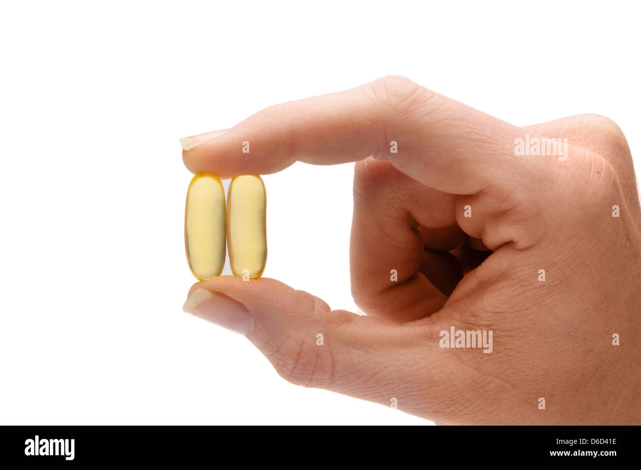 hand holding fish oil capsule Stock Photo