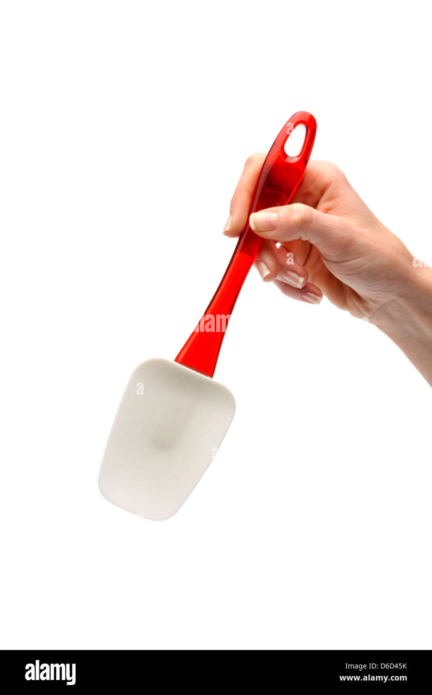 hand holding kitchen spatula Stock Photo