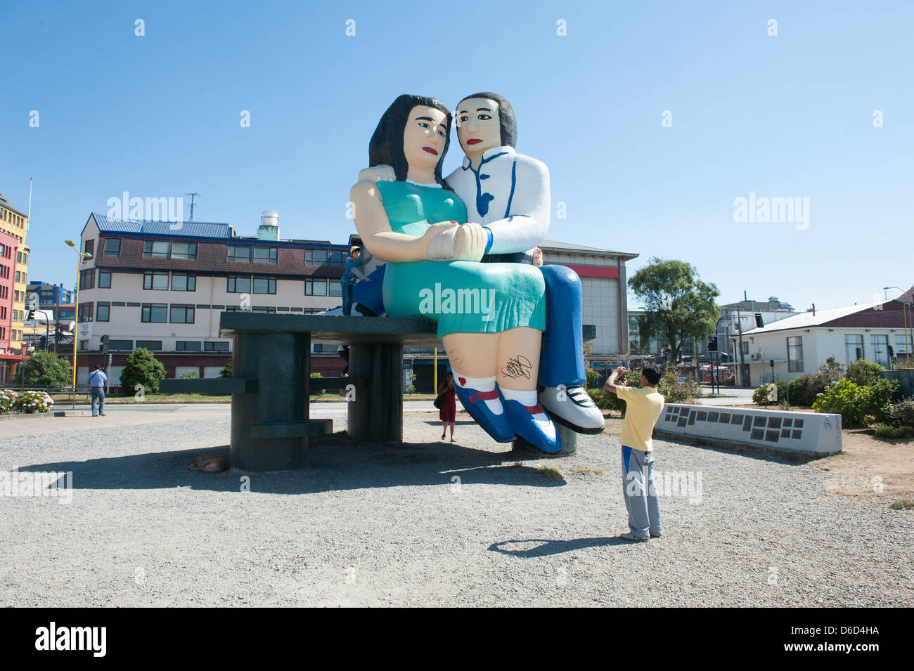 Tourist taking pictures at a tourist attraction sculpture in Puerto Montt, Chile Stock Photo