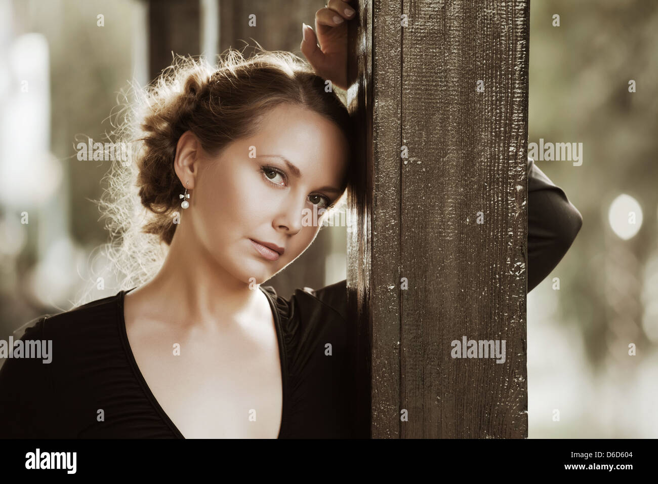 Beautiful young woman on the porch Stock Photo - Alamy