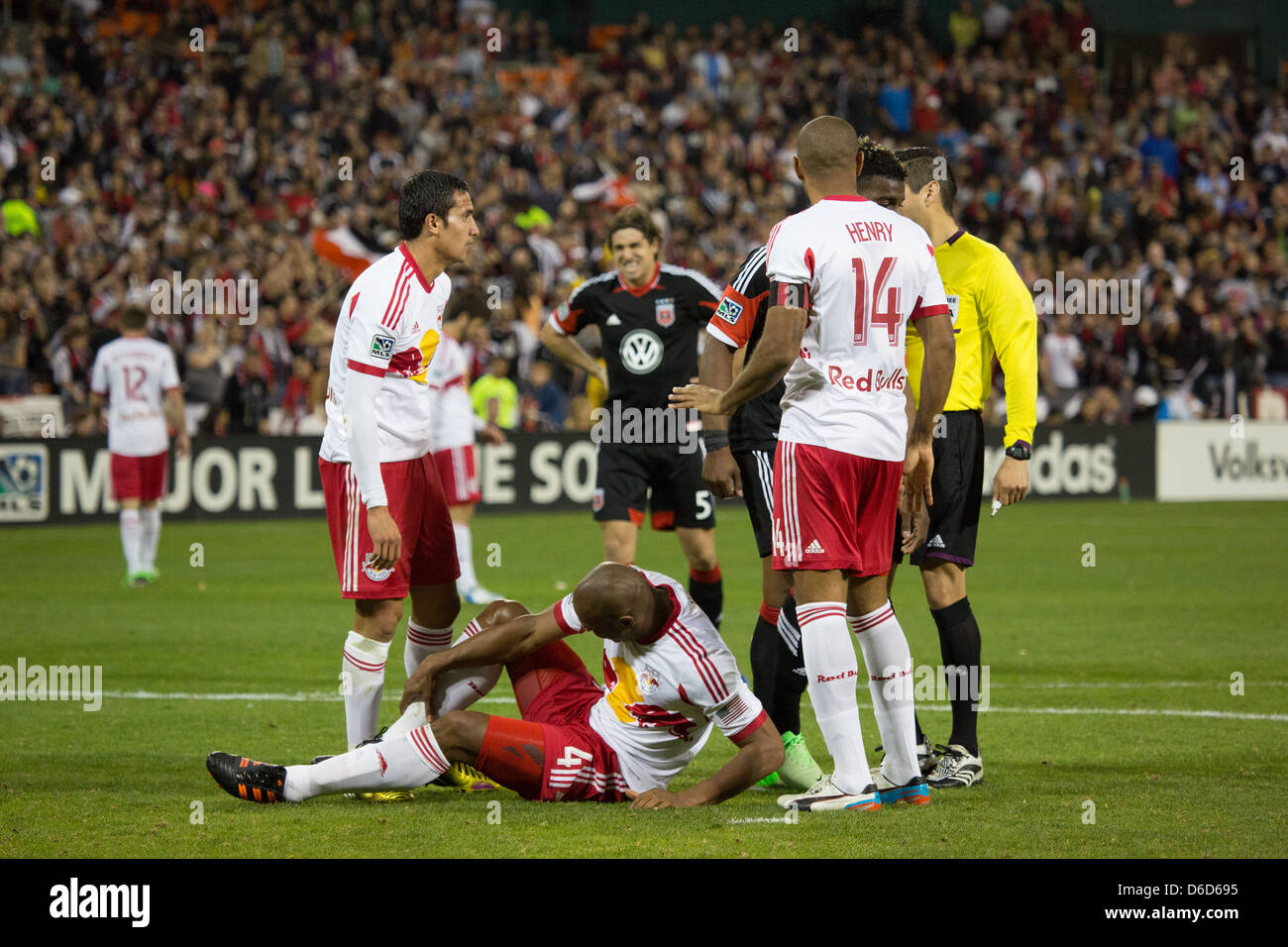 April 13th 2013, NY4 New York RedBulls Forward Thierry Henry (14) comes over to help out injured (4) Olave with (17) Cahill. Stock Photo