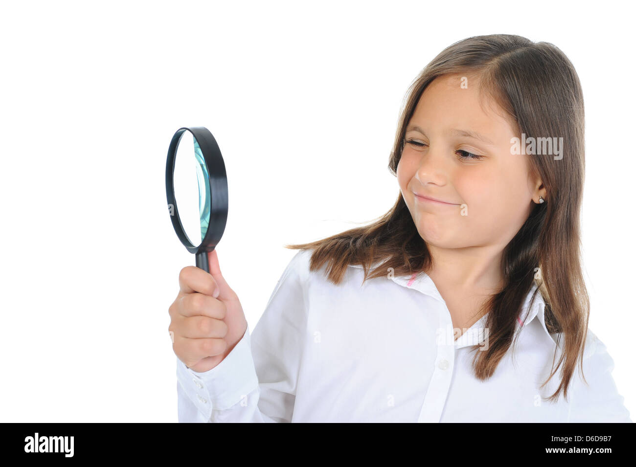 girl looking through a magnifying glass Stock Photo - Alamy