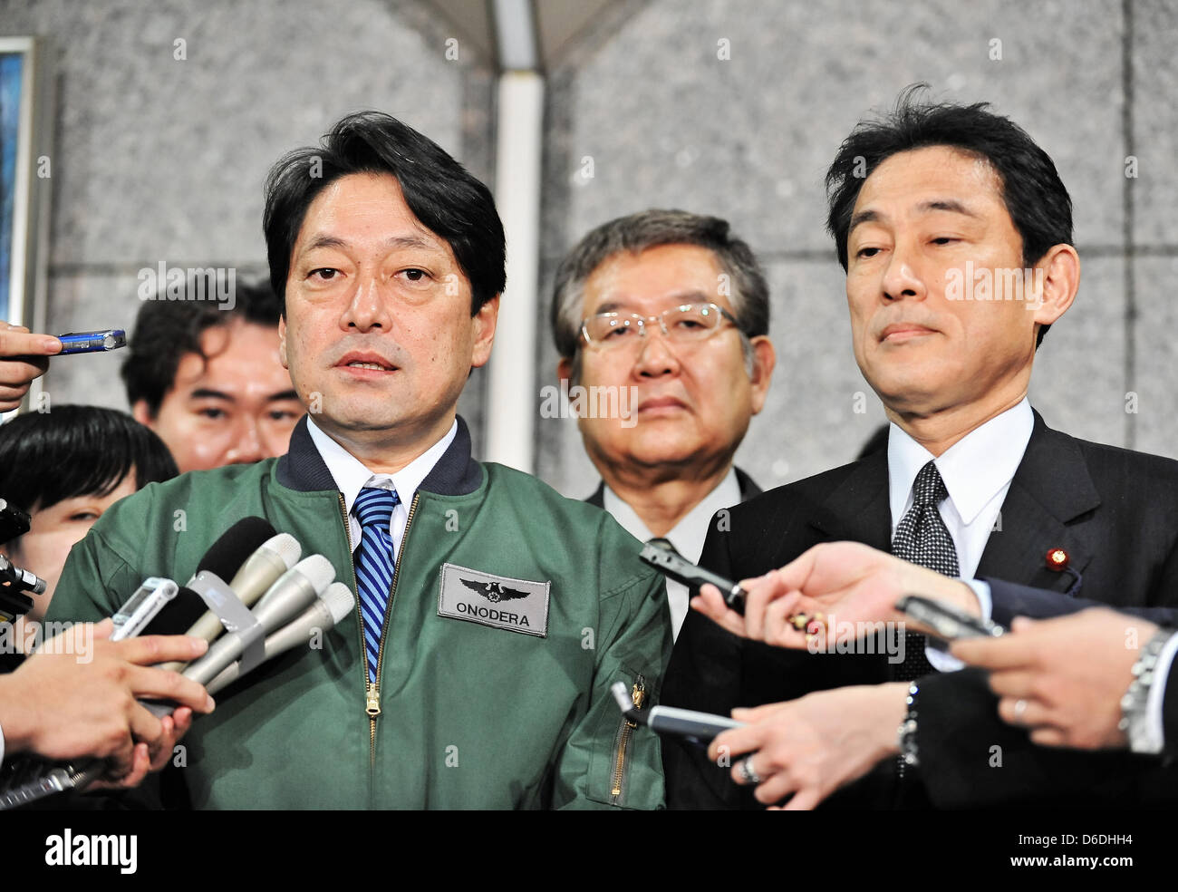 Fumio Kishida, Itsunori Onodera, PAC3, April 13, 2013, Tokyo, Japan : Japan's Foreign Minister Fumio Kishida(R) and Defense Minister Itsunori Onodera(C) speak to reporters after their inspect units of Patriot Advanced Capability-3 (PAC-3) missiles at the Defense Ministry in Tokyo April 13, 2013. (Photo by AFLO) Stock Photo