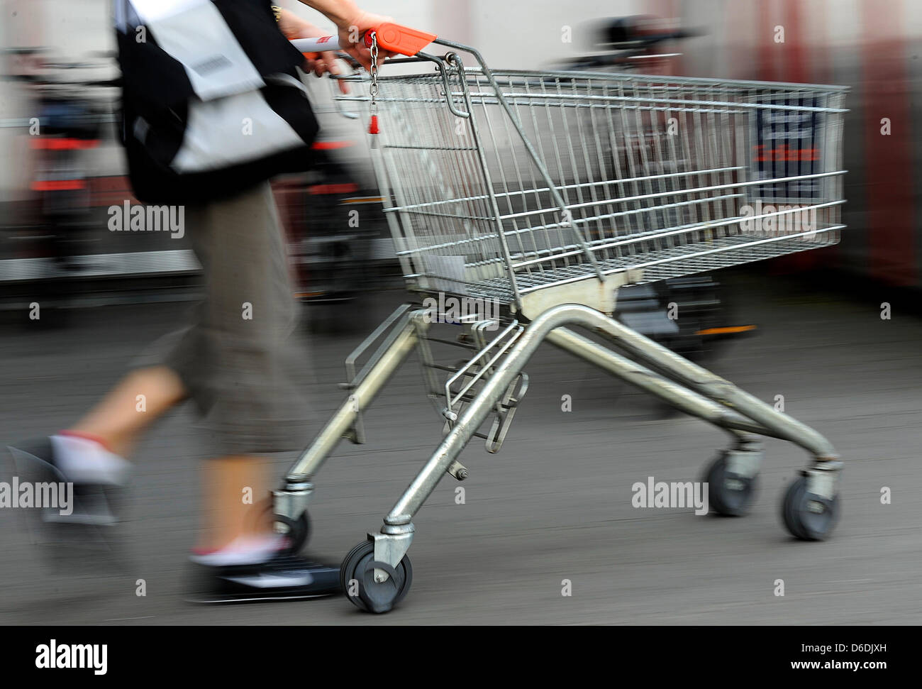 A man pushes a shopping cart in a supermarket in Cologne, Germany, 29