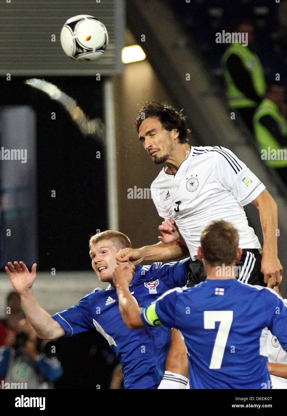 Germany's Mats Hummels (L) and Froedi Benjaminsen (R) of Faroe Islands vie for the ball during the Group C World Cup 2014 qualifying match between Germany and Faroe Islands at AWD Arena in Hanover, Germany, 07 September 2012. Photo: Friso Gentsch dpa/lni  +++(c) dpa - Bildfunk+++ Stock Photo