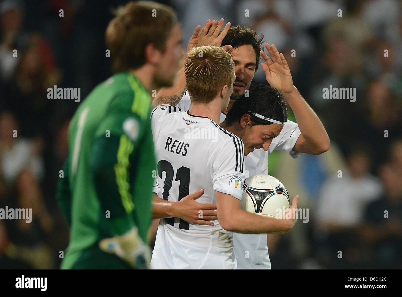 Germany's Mesut Oezil (R) celebrates after scoring the goal 2-0 with team mates Germany's Mats Hummels (2nd R) and Germany's Marco Reus (2nd L) during the Group C World Cup 2014 qualifying match between Germany and Faroe Islands at AWD Arena in Hanover, Germany, 07 September 2012. Photo: Marcus Brandt dpa/lno  +++(c) dpa - Bildfunk+++ Stock Photo