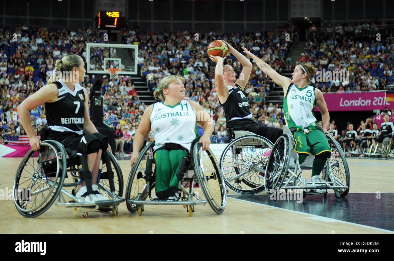 Marina Mohnen (2-r) of Germany tries to score next to Cobi Crispin (r) and Kylie Gauci of Australia and Edina Mueller (l) Germany during the women's wheelchair basketball final match between Germany and Australia at North Greenwich Arena during the London 2012 Paralympic Games, London, Great Britain, 07 September 2012. Photo: Julian Stratenschulte dpa  +++(c) dpa - Bildfunk+++ Stock Photo