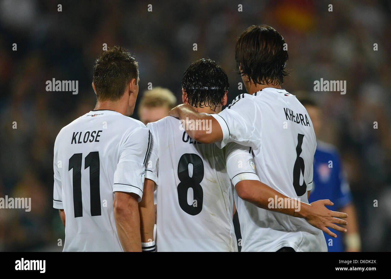 Germany's Mesut Oezil (C) celebrates after scoring the goal 3-0 with team mates Miroslav Klose (L) and Sami Khedira during the Group C World Cup 2014 qualifying match between Germany and Faroe Islands at AWD Arena in Hanover, Germany, 07 September 2012. Photo: Marcus Brandt dpa/lno  +++(c) dpa - Bildfunk+++ Stock Photo