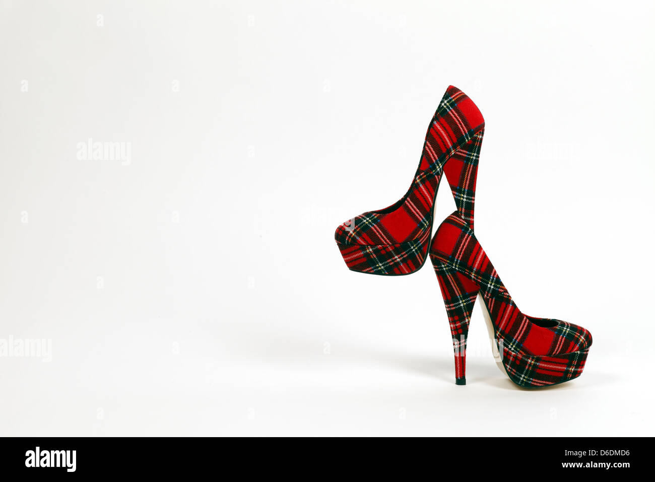 woman very high heels in Tartan cloth Stock Photo