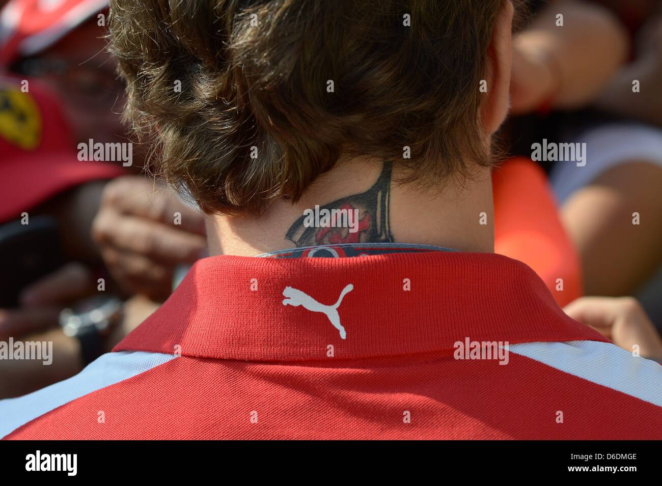 Tattoo in the neck of Spanish Formula One driver Fernando Alonso of Ferrari pictured at the race track Autodromo Nazionale Monza, Italy, 09 September 2012. The Formula One Grand Prix of Italy is the final European race in 2012. Photo: David Ebener dpa Stock Photo
