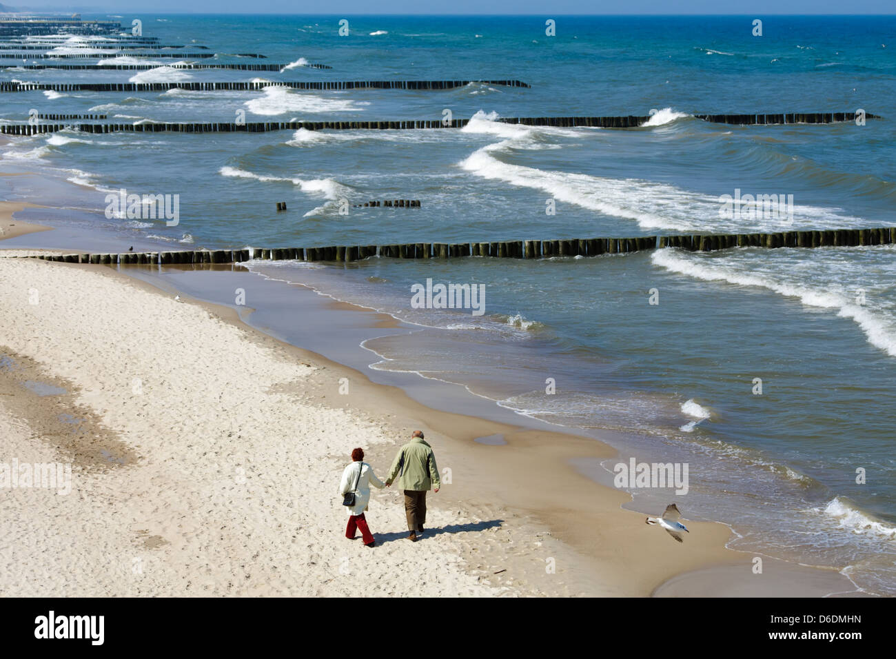 Walking in the sand of a beach Stock Photo