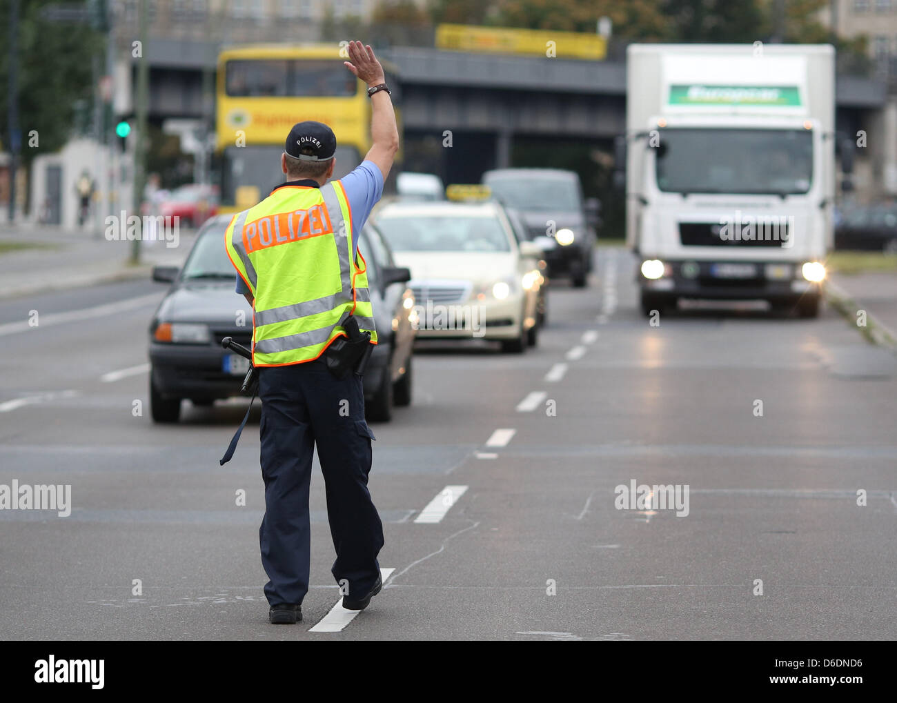A policeman stops a vehicle for a drug control in Berlin, Germany, 31