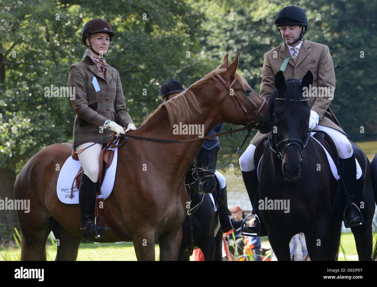 TV presenter Judith Rakers (L) and her husband Andreas Pfaff take part in the sixth Cross Country drag hunt near Putbus on the Island of Ruegen, Germany, 08 September 2012. Photo: Stefan Sauer Stock Photo