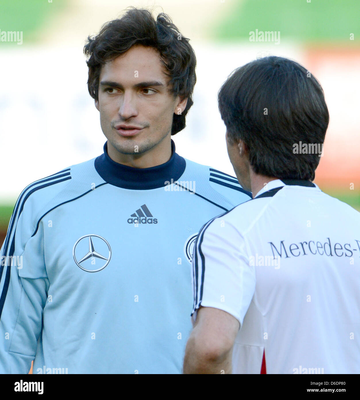 Germany's head coach Joachim Loew (R) talks to player Mats Hummels during a practice session of the national soccer team at Ernst Happel Stadium in Vienna, Austria, 10 September 2012. The German national soccer team prepares for its upcoming FIFA World Cup 2014 qualification match against Austria on 11 September. Photo: Peter Steffen Stock Photo