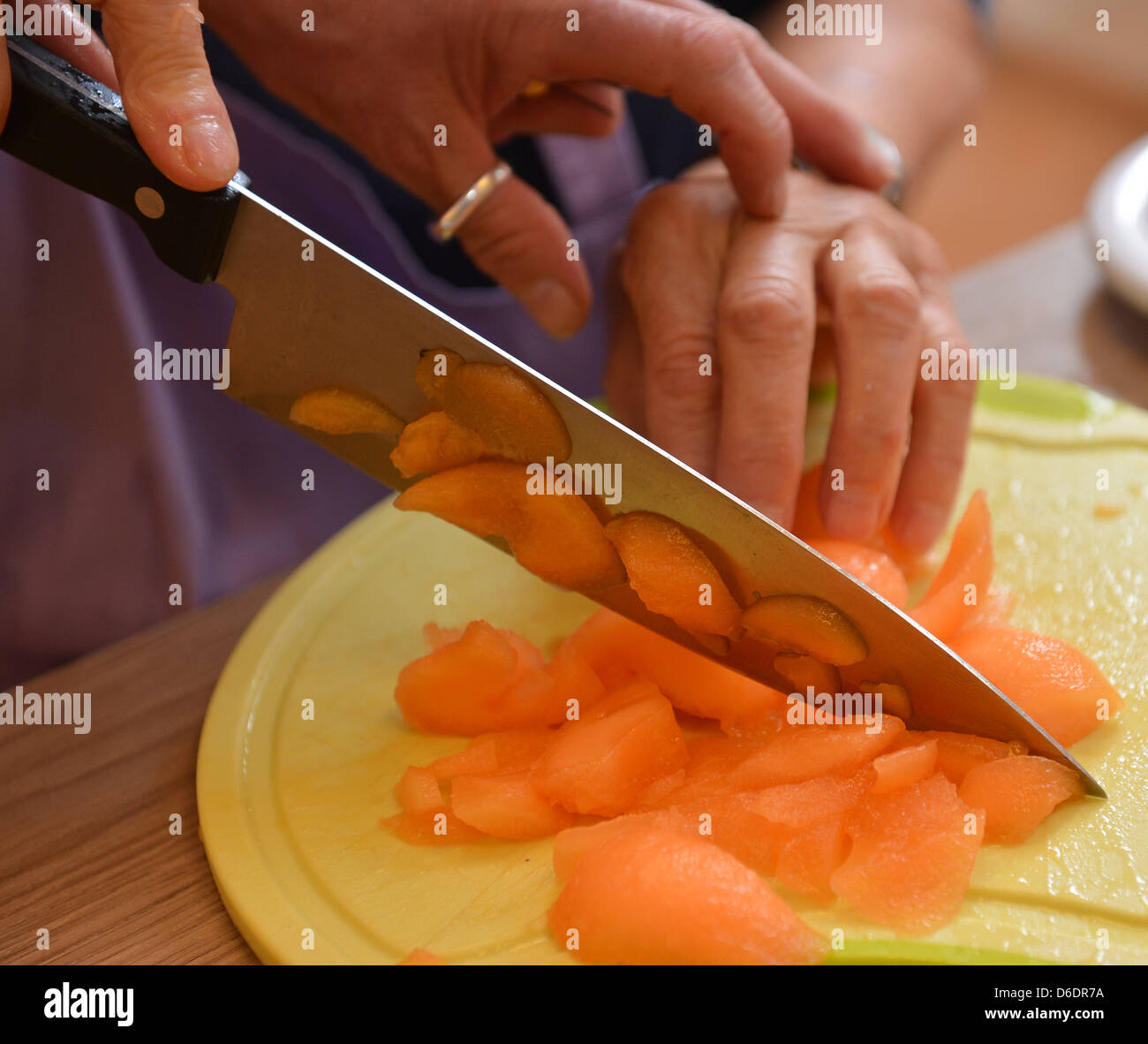Course instructor Barbara Kunert assists senior resident Rita Plump (83