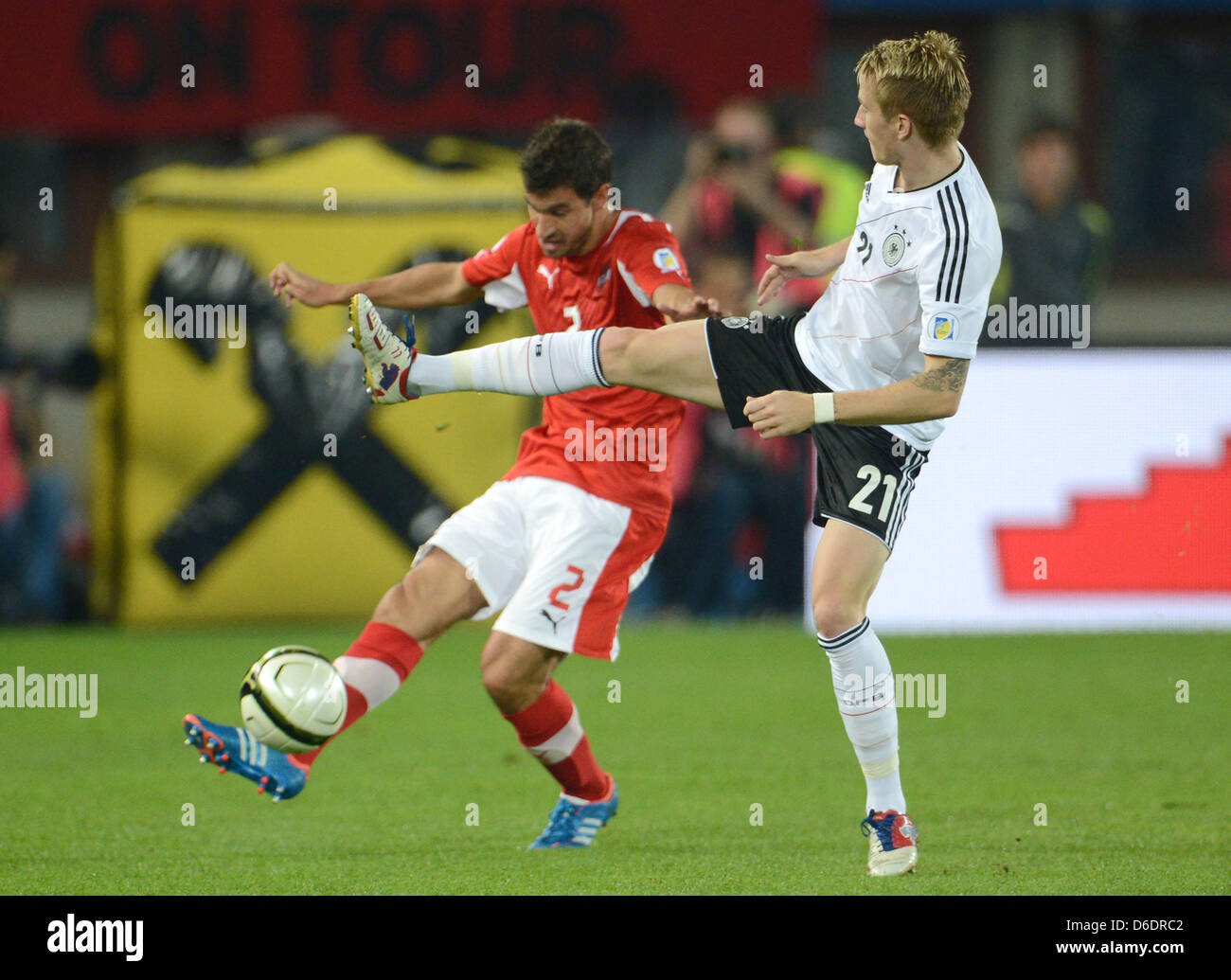 Austria's György Garics (L) and Marco Reus of Germany vie for the ball  during the Group C World Cup 2014 qualifying match between Austria and  Germany at Ernst-Happel stadium in Vienna, Austria,