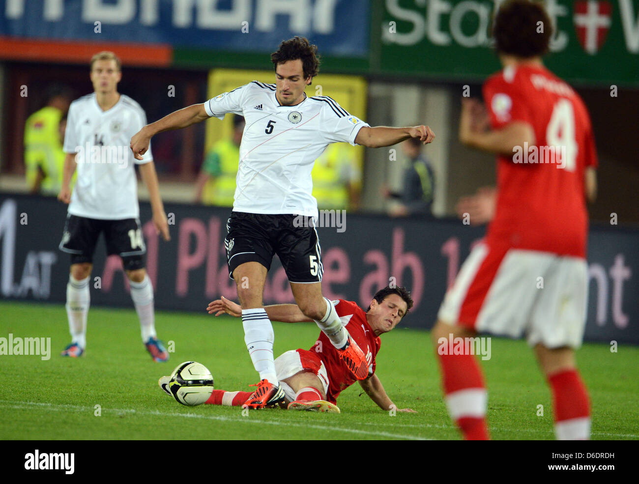 Germany's Mats Hummels vies for the ball with Austria's Zlatko Junuzovic (bottom) during the Group C World Cup 2014 qualifying match between Austria and Germany at Ernst-Happel stadium in Vienna, Austria, 11 September 2012. Photo: Peter Steffen dpa  +++(c) dpa - Bildfunk+++ Stock Photo