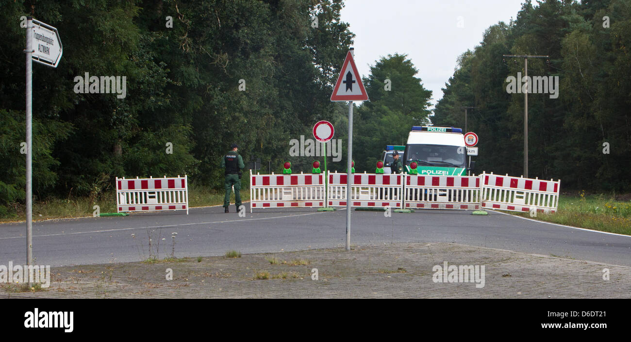 A police vehichle sits on the blocked-off Heidestrasse in the direction of the Altmark military training area near Haldensleben, Germany, 12 September 2012. A few rallies against the Altmark military training area have been registered. However, the administration court in Magdeburg has prohibited a demonstration at the training center in Colbitz-Letzlinger Heide. Photo: JENS WOLF Stock Photo