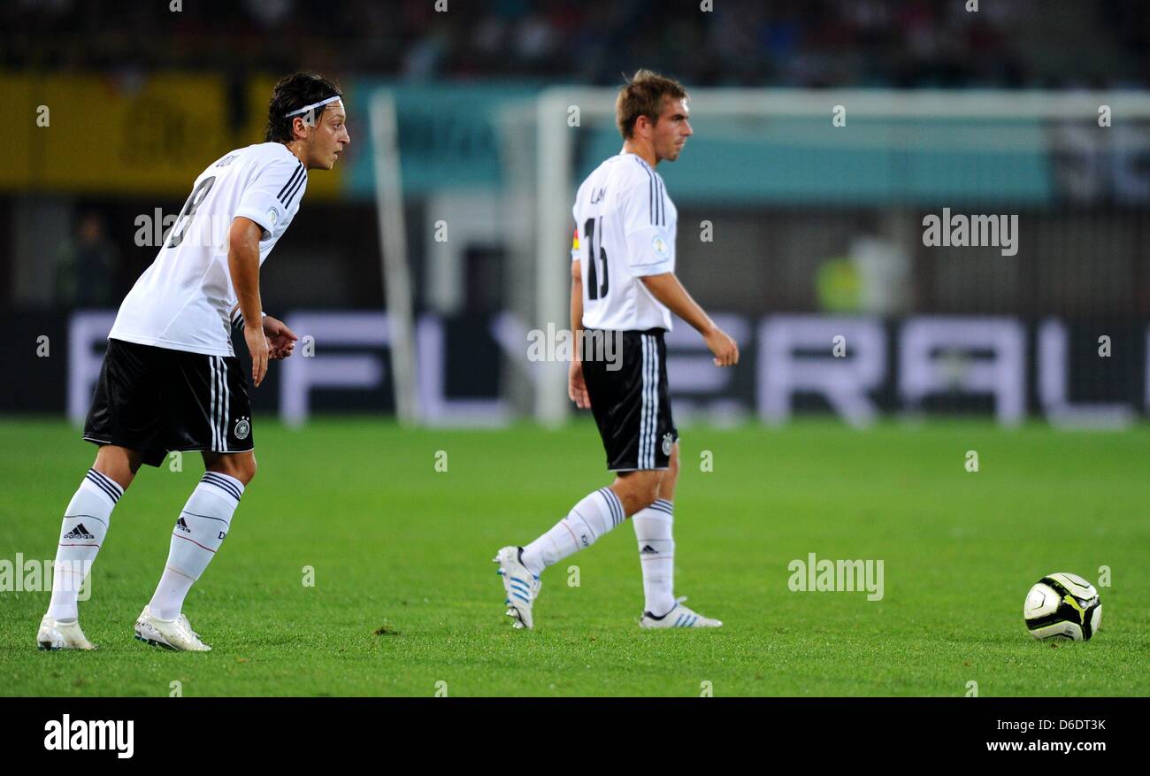 Germany's Mesut Ozil kicks a freekick next to Philipp Lahm during the World Cup qualification match between Austria and Germany at Ernst-Happel-Stadium in Vienna, Germany, 11 September 2012. Photo: Thomas Eisenhuth Stock Photo