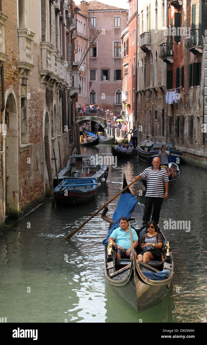 Gondolas and boats are visible on a channel in Venice, Italy, 07 September 2012. Photo: Jens Kalaene Stock Photo