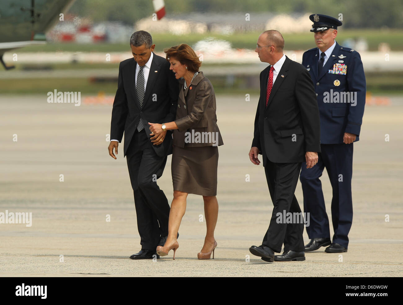 United States President Barack Obama is greeted by Colonel Michael Minihan, 89th Air Wing Commander, Joint Base Andrews, and Capricia Marshall, Chief of Protocol, as he arrives to JBA to attend the Transfer of Remains Ceremony marking the return to the United States of the remains of the four Americans killed this week in Benghazi, Libya, at Joint Base Andrews on Friday, September  Stock Photo