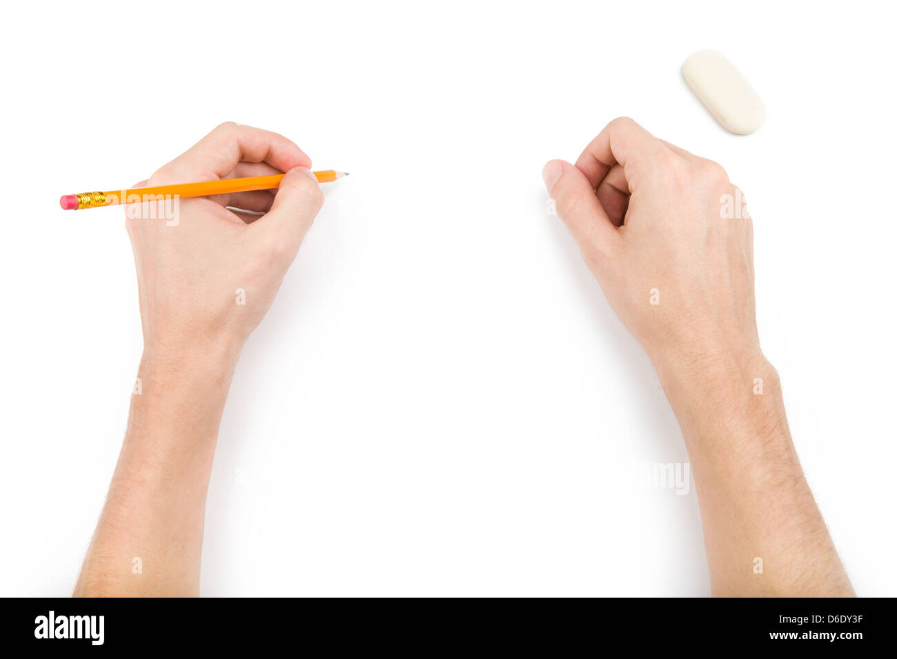 Left-hander with pencil writing something Stock Photo