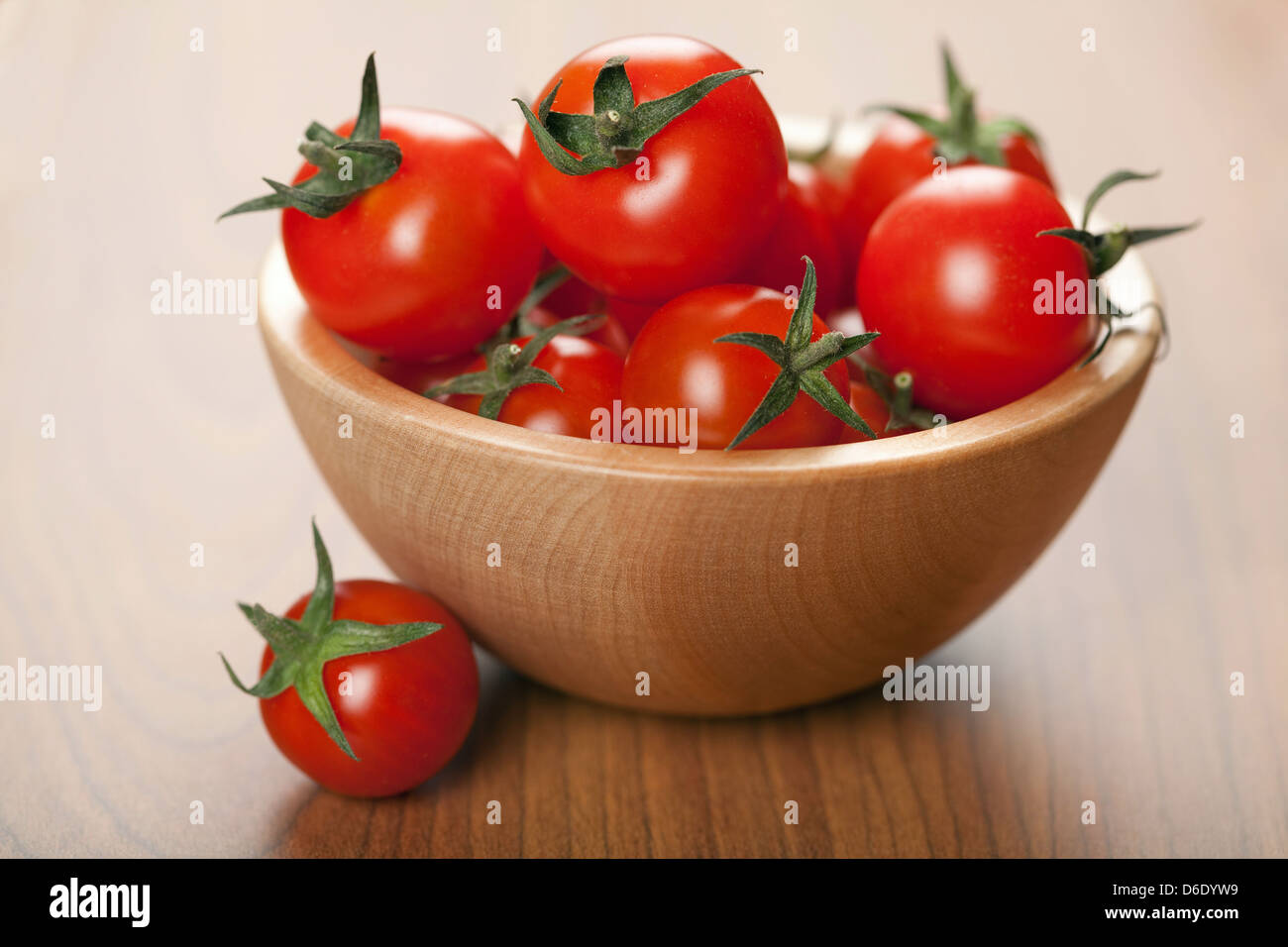 Cherry tomatoes in wooden bowl hi-res stock photography and images - Alamy