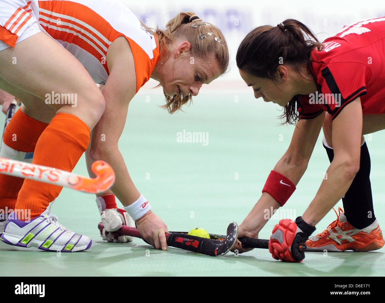 Netherland's Belle van Meer (L) and Poland's  Marlena Rybacha fight for the ball during the European Indoor Hockey Championship match between Poland and The Netherlands at the Arena Leipzig in Leipzig, Germany, 15 January 2012. Photo: HENDRIK SCHMIDT Stock Photo