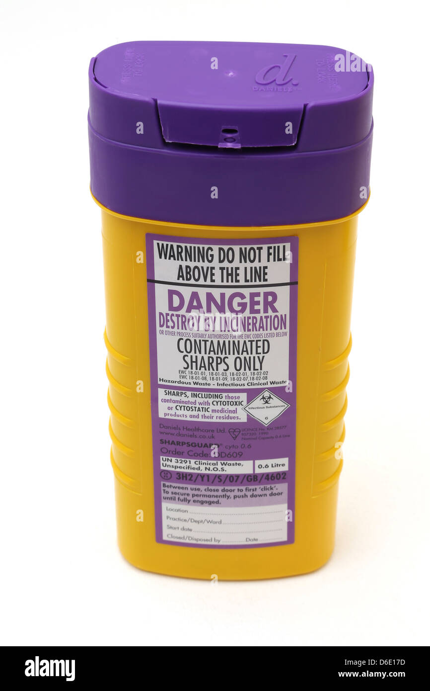 Sharps Bin with Purple Lid Closed For Medical Waste Needles Stock Photo