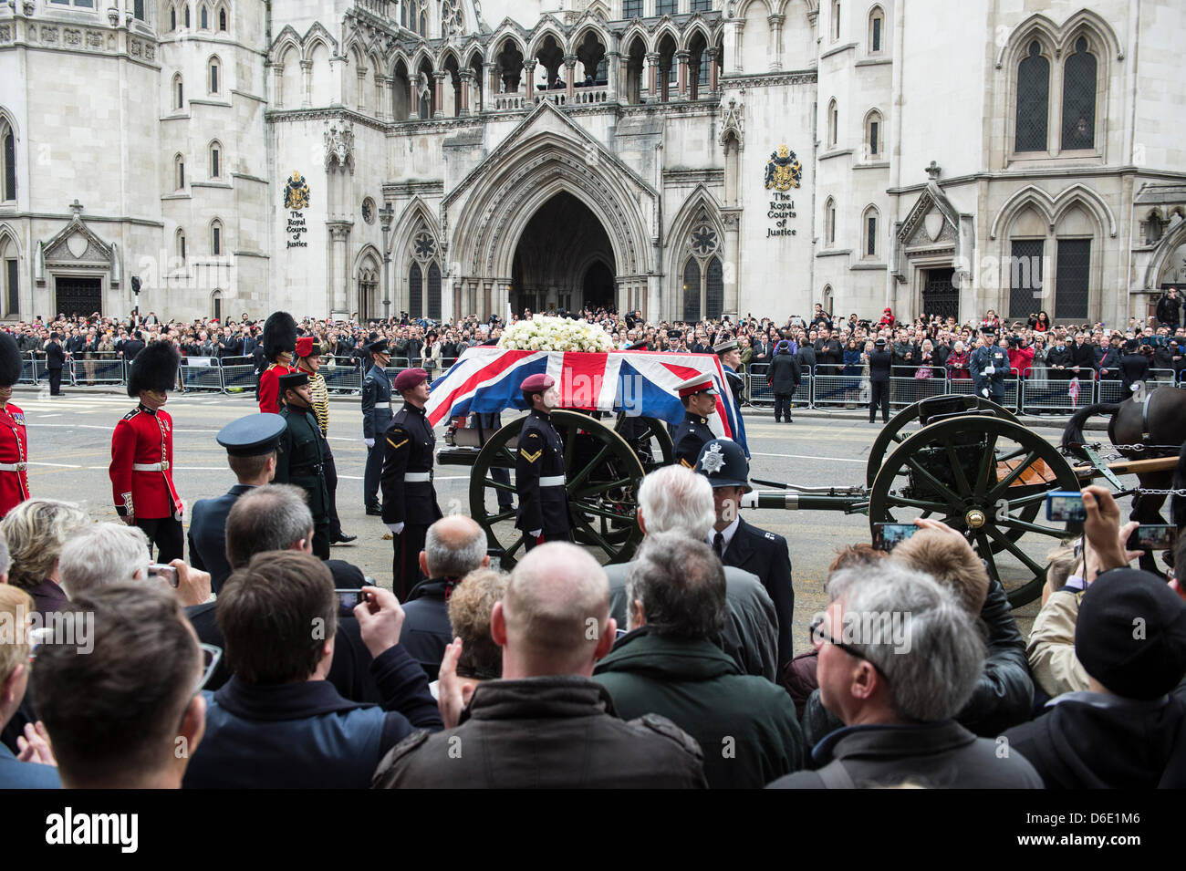 London, UK. 17th April 2013. Lady Thatcher’s coffin passes along The Strand on a gun carriage en-route to St. Paul’s Cathederal for a State Funeral. The fact that Lady Thatcher has been given a State Funeral and from the public purse has lead to fierce debate both in and out of Parliament. Credit:  Allsorts Stock Photo/Alamy Live News Stock Photo