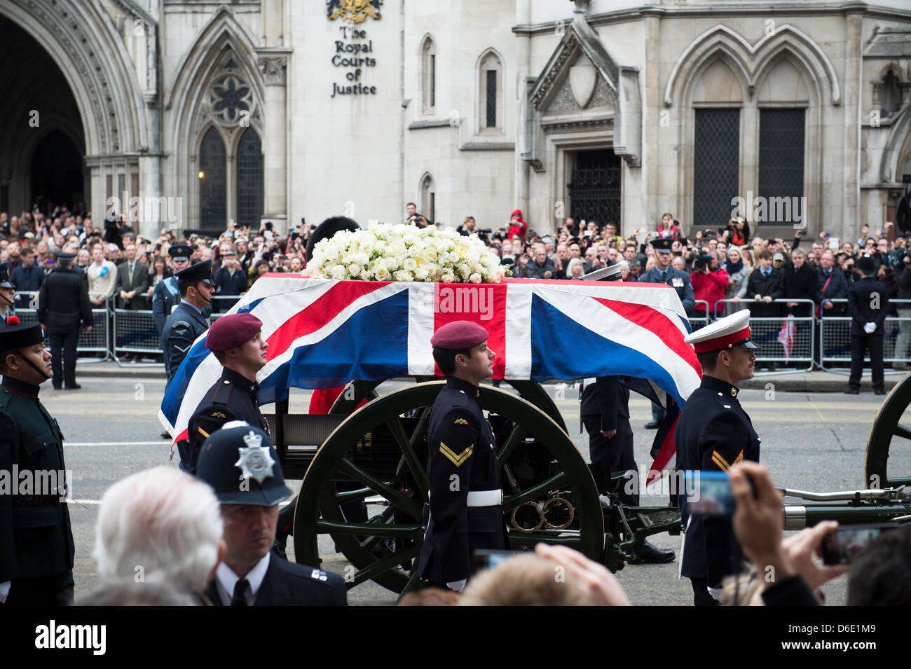 London, UK. 17th April 2013. Lady Thatcher’s coffin passes along The Strand on a gun carriage en-route to St. Paul’s Cathederal for a State Funeral. The fact that Lady Thatcher has been given a State Funeral and from the public purse has lead to fierce debate both in and out of Parliament. Credit:  Allsorts Stock Photo/Alamy Live News Stock Photo