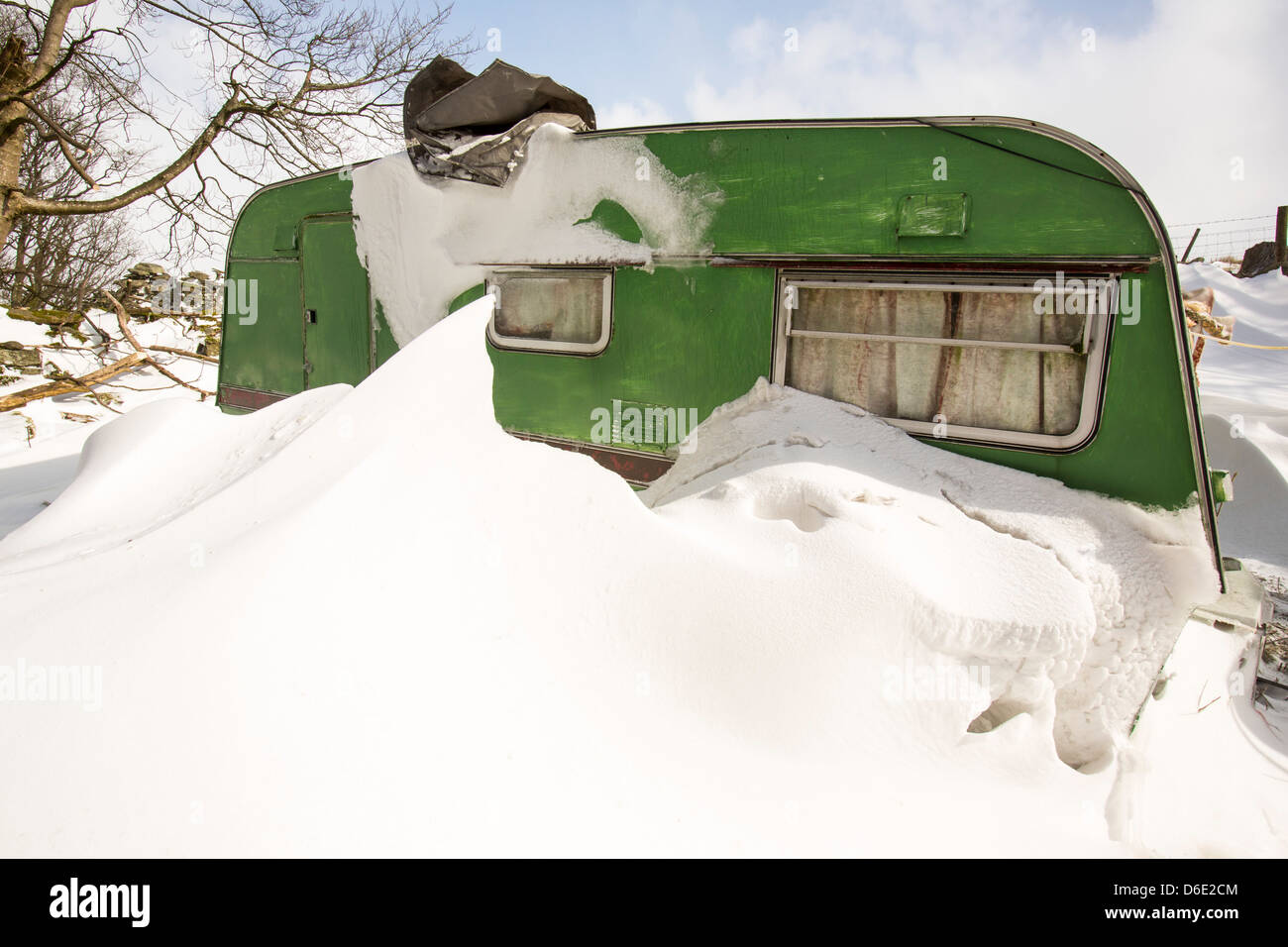 A caravan snowed in by large snow drifts during the extreme weather event of late March 2013, Stock Photo