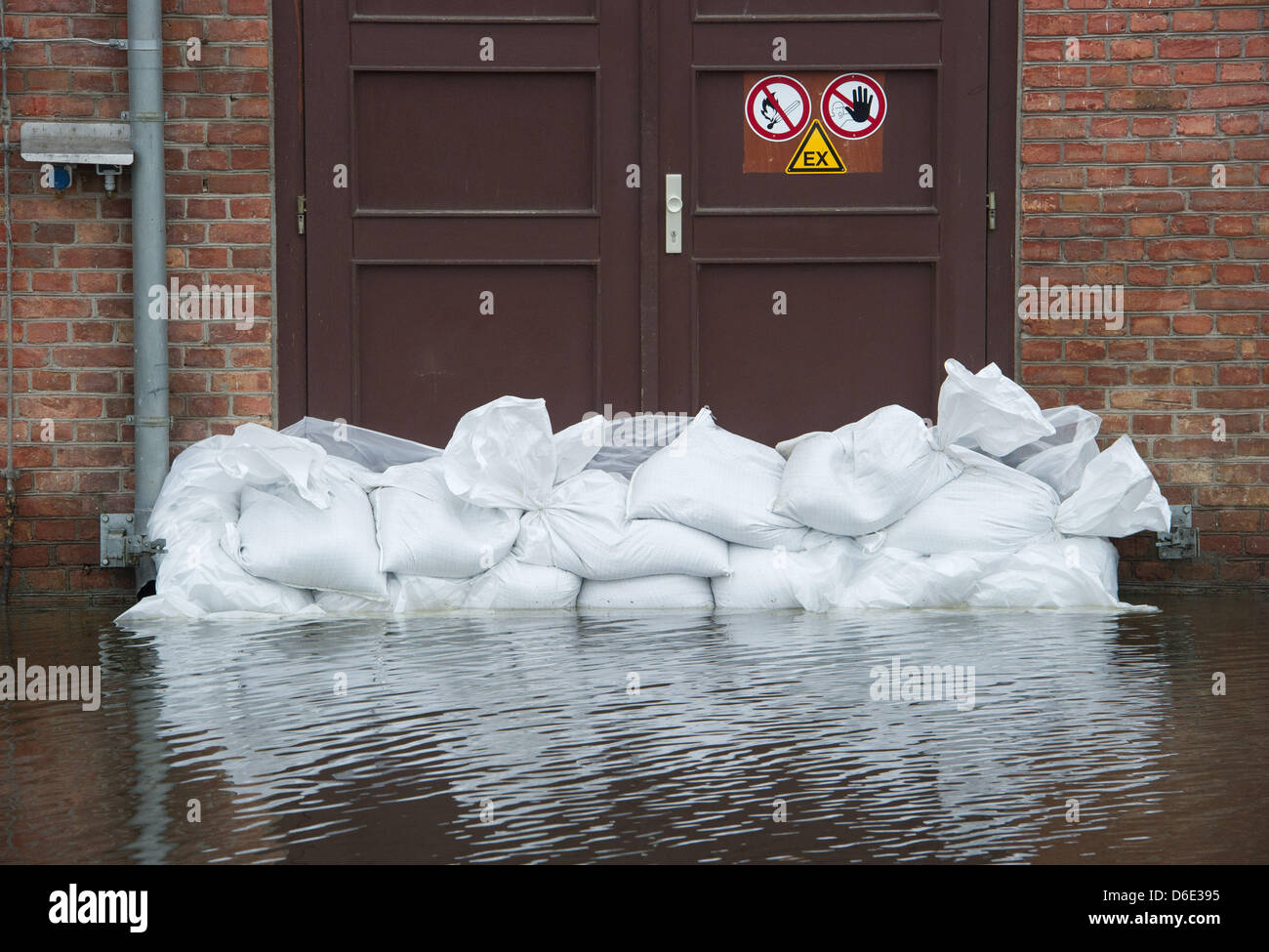 A door is sandbagged at the port of Jarmen, Germany, 16 January 2012. The Peene river has risen and partly flooded the port. Photo: Stefan Sauer Stock Photo