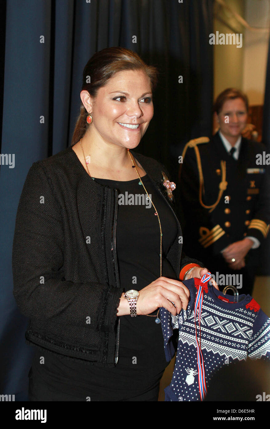 Pregnant Crown Princess Victoria of Sweden receives a present during(01)