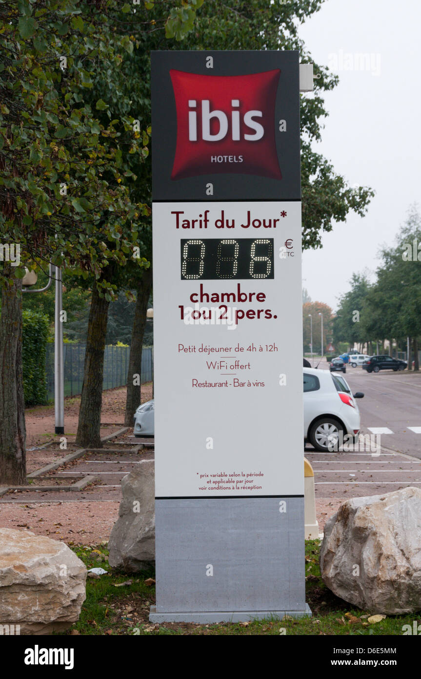 Sign outside an Ibis Hotel in France gives the daily rate for a room. Stock Photo
