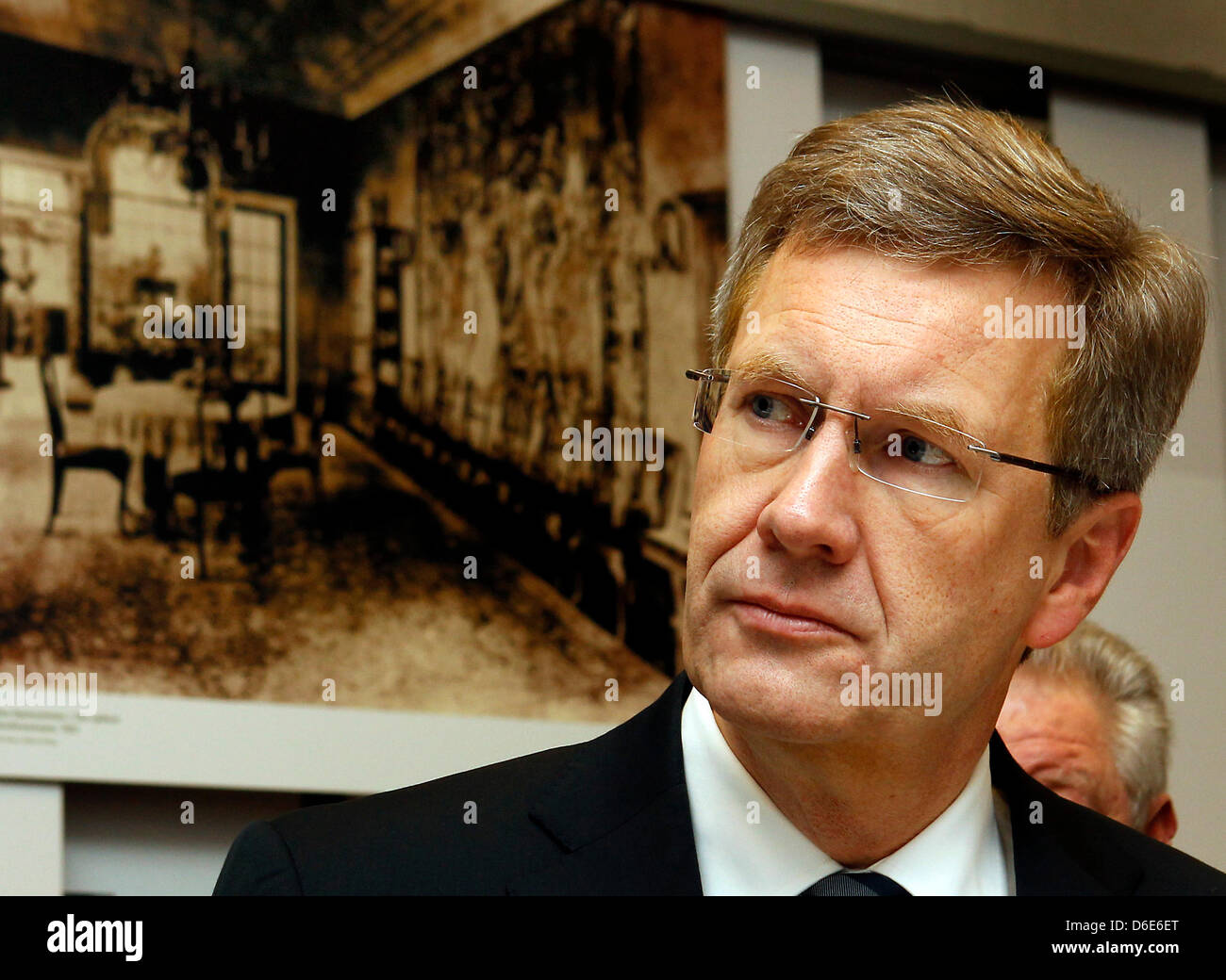 German President Christian Wulff listens to explanations of the director of the memorial and educational site House of the Wannsee Conference, Norbert Kampe (not in picture), during a commemorative event on the occasion of the 70th anniversary of the 'Wannsee Conference' at the House of the Wannsee Conference in Berlin, Germany, 20 January 2012. In this house - a former industriali Stock Photo