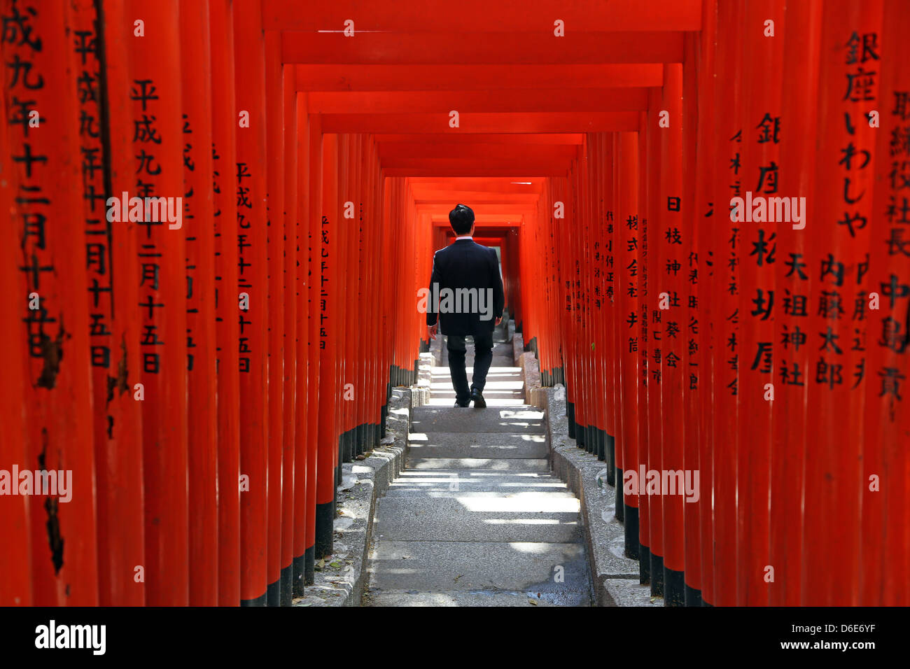 Red Torii gates and steps to the entrance to the Hie-Jinja Shinto Shrine in Tokyo, Japan Stock Photo
