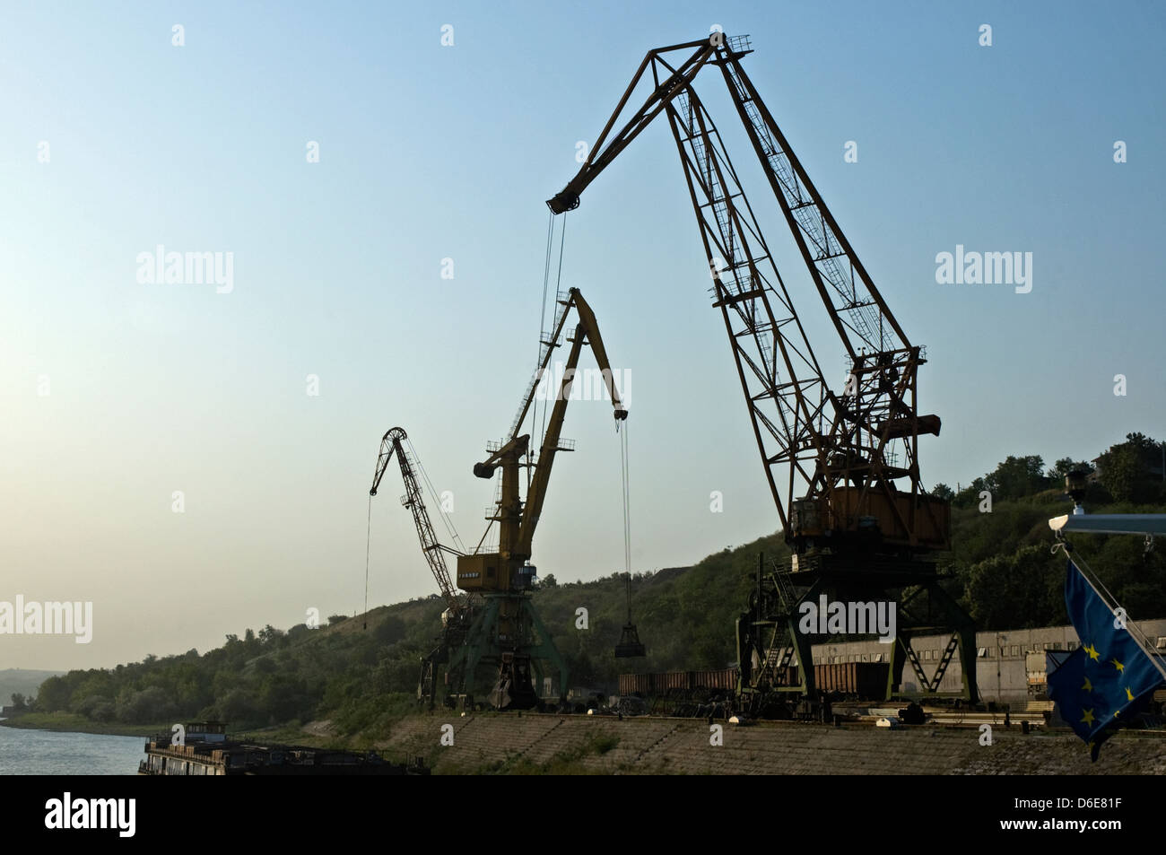 EUROPE, BULGARIA, Svistov, cranes unloading coal at the dock Stock Photo