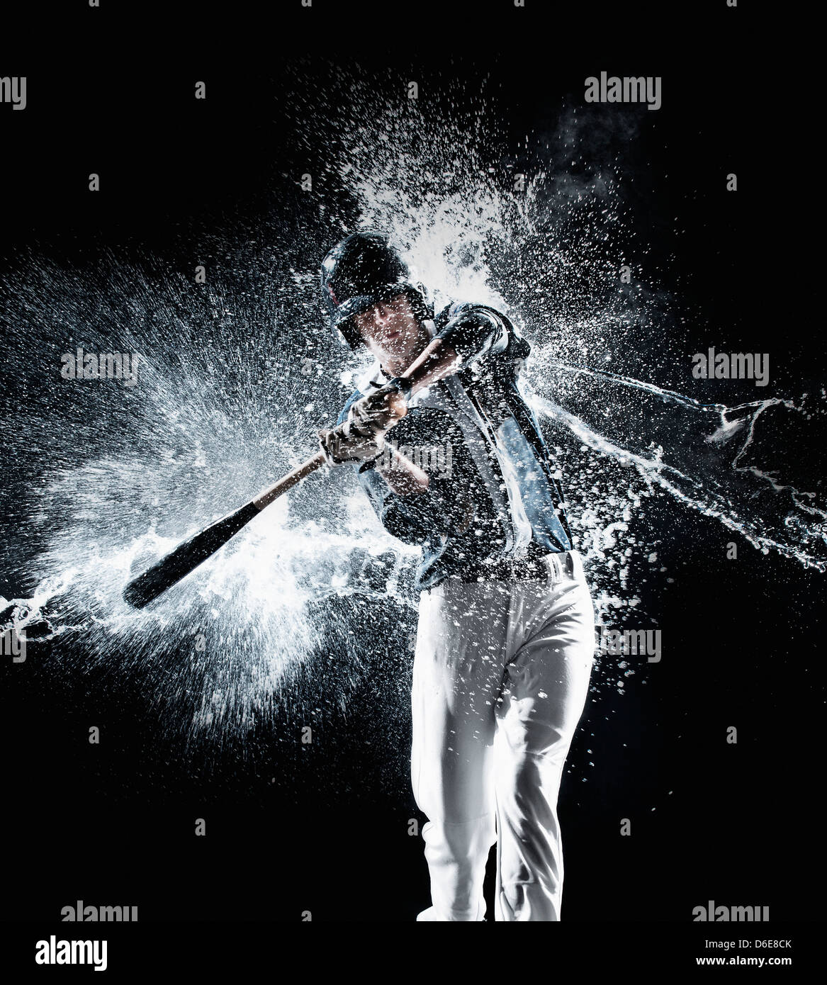 Caucasian baseball player splashing in water Stock Photo Alamy