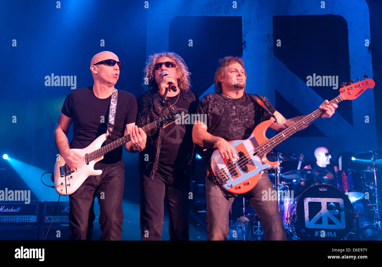 The members of the music project Chickenfoot  Joe Satriani (L-R), Sammy Hagar and Michael Anthony perform on stage during a concert tour in Duesseldorf, Germany, 19 January 2012. Four major musicians of rock music have come together to form the line-up of the unusual music project Chickenfoot. The line-up consists of Sammy Hagar, former singer of the US-band Van Halen, Michael Anth Stock Photo